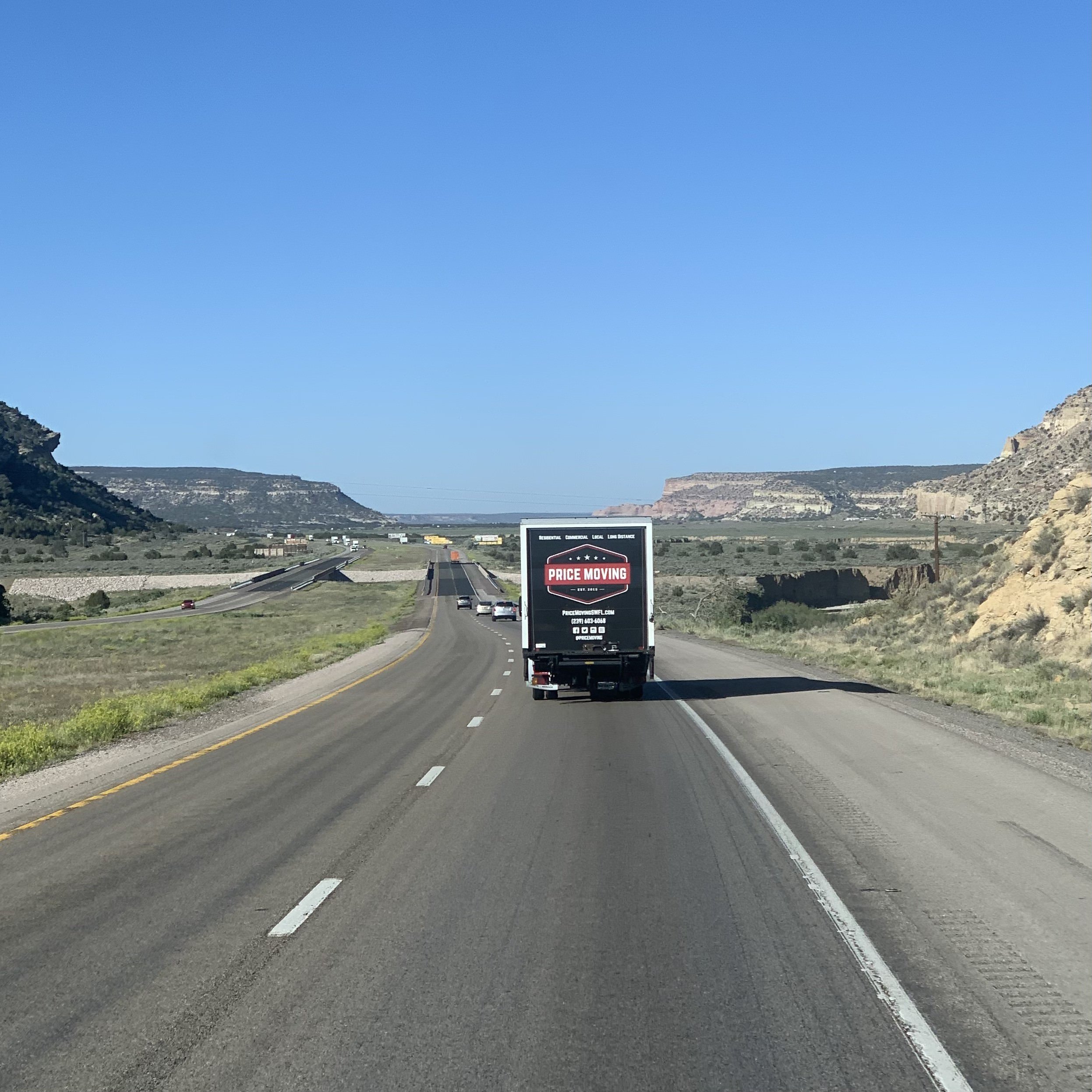Price Moving truck on the highway for a long distance move
