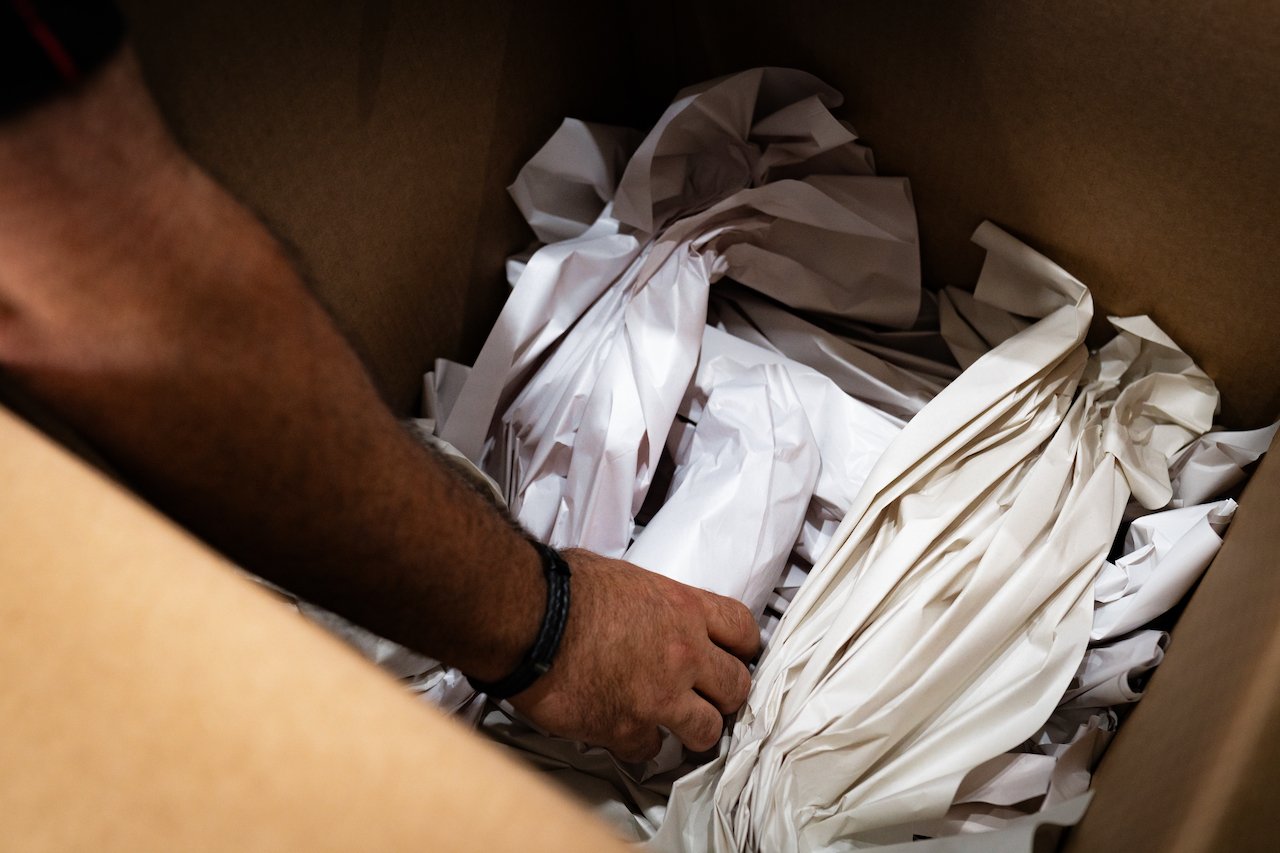Careful packing of fragile items in a box